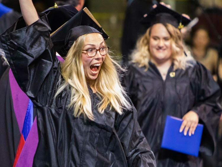 Sabrina Hahn of Germany celebrates after receiving her degree in Early Childhood Education during the Southern Maine Community College commencement Sunday at the Cross Insurance Arena in Portland.
