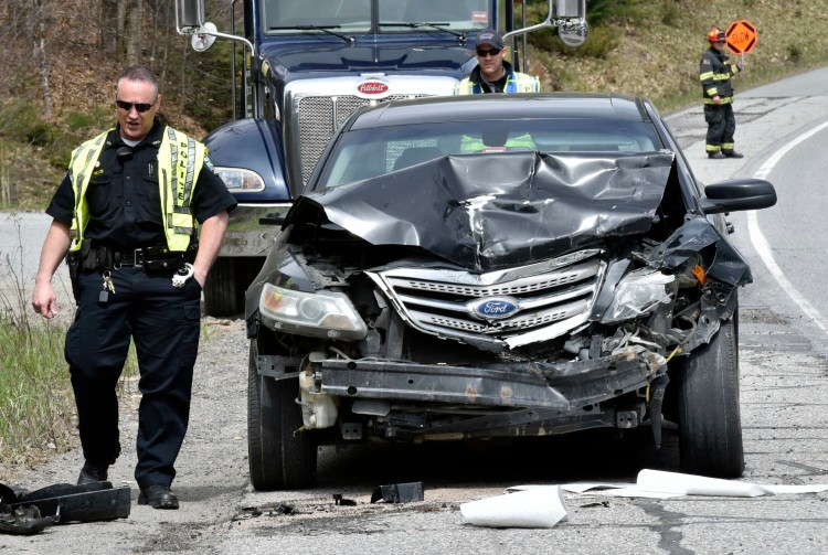 Skowhegan police officers investigate one of two vehicles involved in an accident Monday morning on U.S. Route 201 in Skowhegan. One person was taken to Redington-Fairview Hospital by ambulance.