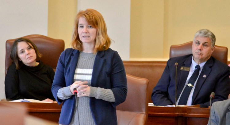 Sen. Heather Sanborn, D-Portland, speaks during debate Tuesday on a bill to remove religious exemptions from the state’s school vaccination law. Sens. Shenna Bellows, D-Manchester, and Scott Cyrway, R-Albion, listen behind her. 