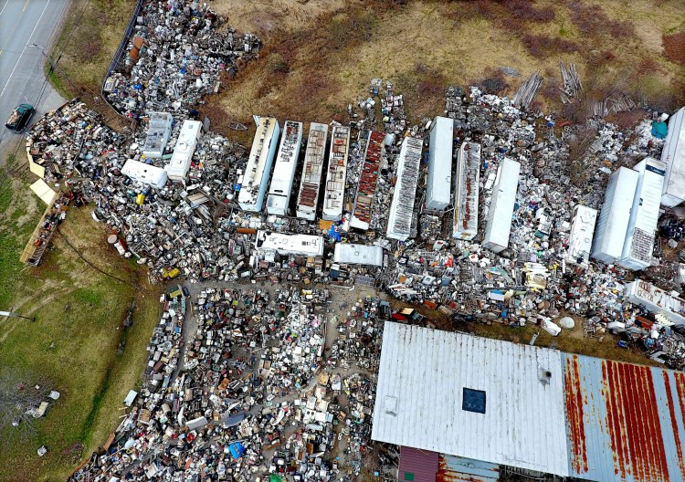 An aerial photograph of Robert Dale’s property on May 1 defines the extent to which his stock has grown, squeezing out the driveway to U.S. Route 201 in Fairfield. Trailers not only contain material but support it on their roofs.