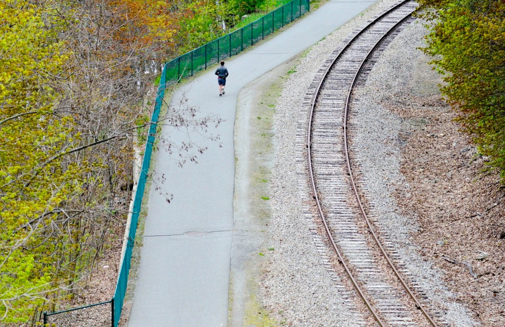 A runner heads south in 2019 along the Kennebec River Rail Trail in Augusta. 