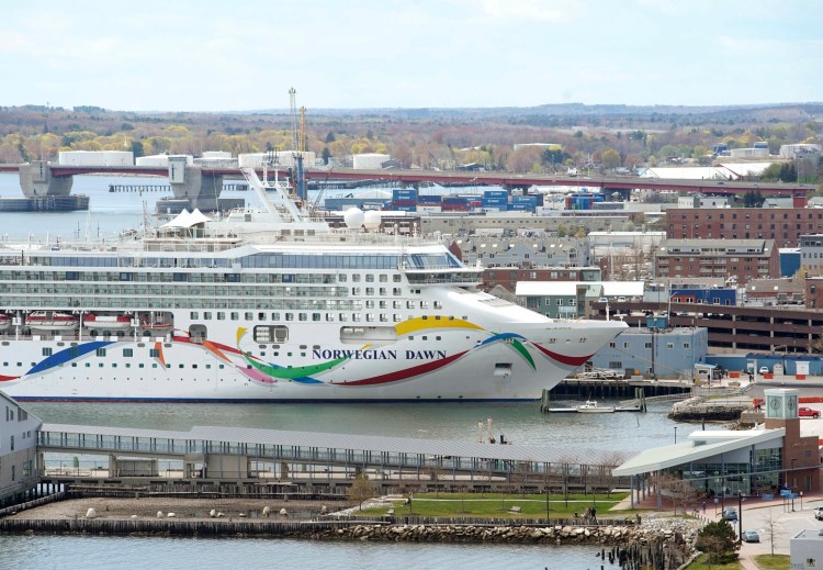 The Norwegian Dawn is moored in Portland Harbor earlier this year. A state report released Thursday says most cruise ship passengers like Maine ports and spend about $70 each while on a typical four-hour visit.