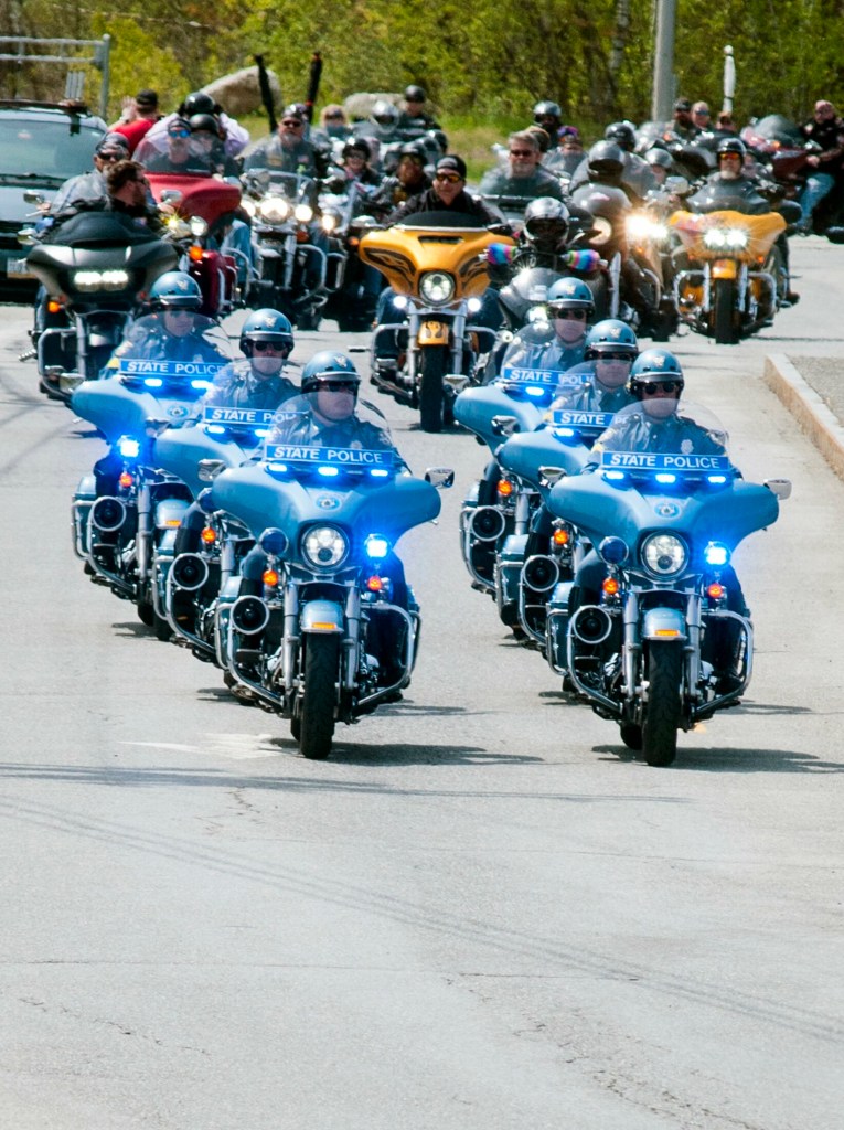 State police troopers on motorcycles lead The Summit Project convoy on Saturday as the group leaves the West Gardiner service plaza on the Maine Turnpike. 