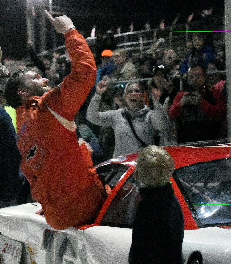 Ben Ashline celebrates after winning the Coastal 200 on Sunday at the Wiscasset Speedway.