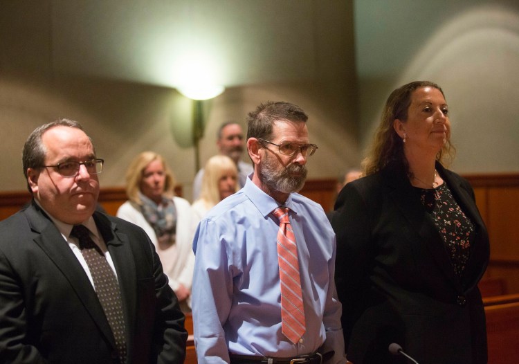 Gregory Vance stands next to his attorneys, Robert LaBrasseur and Tina Heather Nadeau, during his arraignment Wednesday. He pleaded not guilty to a murder charge in the death of his girlfriend, Patricia Grassi. 