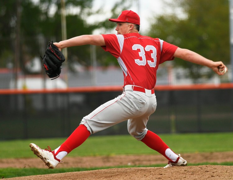 South Portland's Noah Lewis delivers a pitch against Biddeford on Wednesday. Lewis pitched a complete game as the Red Riots won 3-0.