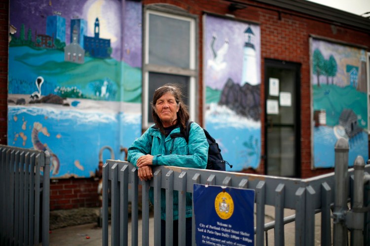 Cheryl McAllister, 62, poses for a portrait outside Oxford Street Shelter on Thursday. She's been staying at the shelter since 2002.
