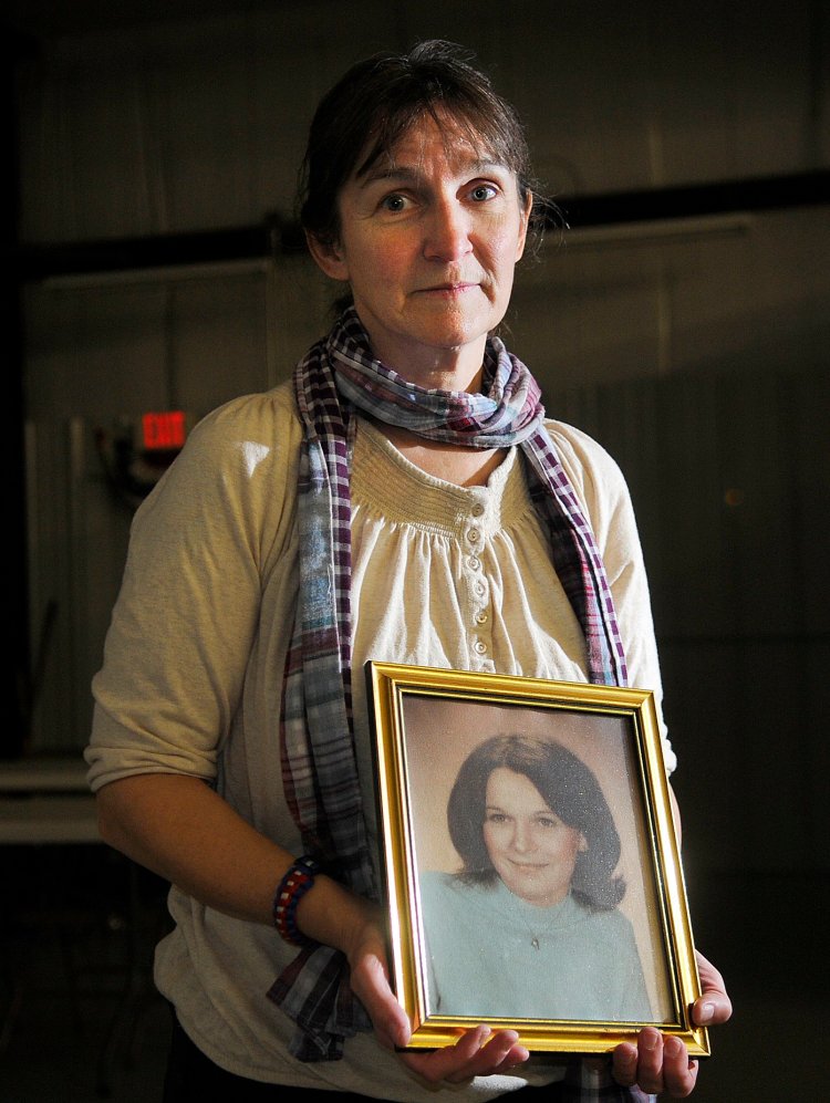 West Gardiner resident Vicki Dill, seen in 2013 holding a photo of her sister Debra, opposed the parole of Michael Boucher on Monday. Boucher was convicted in 1991 for beating Debra Dill, 18, to death with a hammer in 1973 in Litchfield.