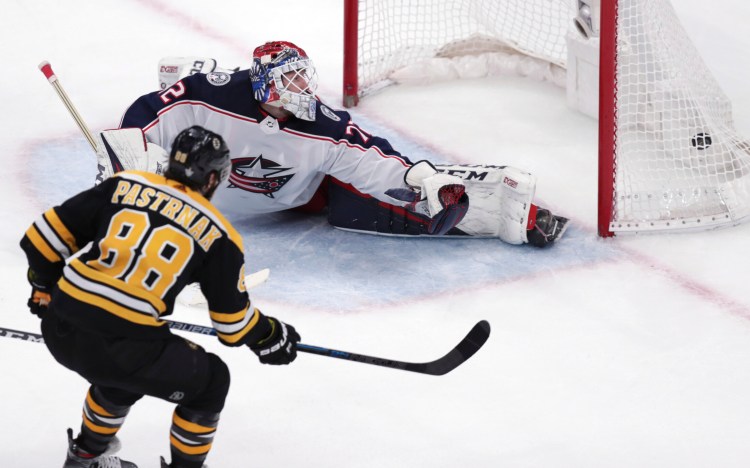 Bruins right wing David Pastrnak beats Blue Jackets goaltender Sergei Bobrovsky for the winning goal in Boston's 4-3 win Saturday in Boston. The Bruins took a 3-2 lead in their Eastern Conference semifinal with the win. 