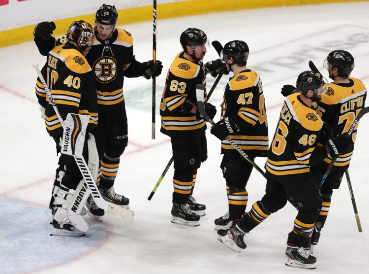 Tuuka Rask, 40, and the Boston Bruins celebrate after beating Columbus 4-3 in Game 5 of their Eastern Conference semifinal series on Saturday in Boston. The Bruins hold a 3-2 lead and can close out the series on Monday in Columbus, Ohio.