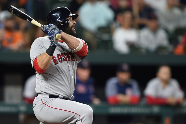 Mitch Moreland of the Red Sox launches a three-run homer in the fifth inning Tuesday night at Baltimore.