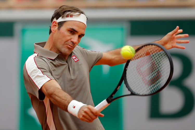 Switzerland's Roger Federer plays a shot against Italy's Lorenzo Sonego during their first round match of the French Open tennis tournament at the Roland Garros stadium in Paris, Sunday, May 26, 2019. (AP Photo/Michel Euler )