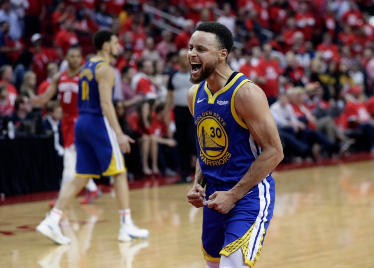 Warriors guard Stephen Curry celebrates after the Warriors beat Houston, 118-113, in Game 6 of the Western Conference semifinals. The Warriors won the series 4-2 to advance to the conference finals.