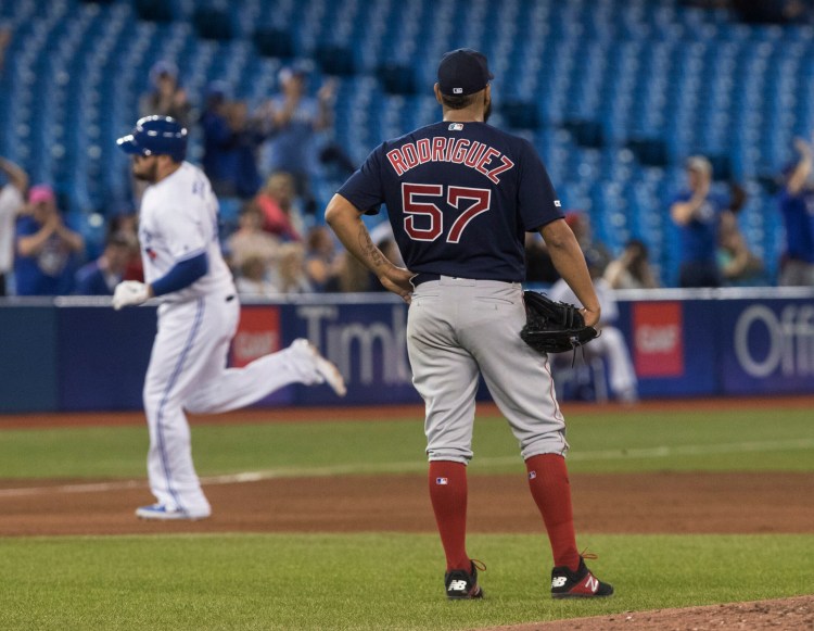 Red Sox starting pitcher Eduardo Rodriguez watches Toronto's Rowdy Tellez round the bases on a home run during the fifth inning of the Blue Jays' 10-3 win Tuesday in Toronto.