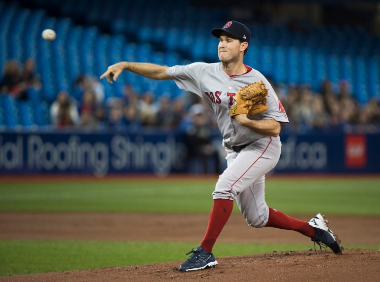 Boston Red Sox starting pitcher pitcher Ryan Weber works against the Toronto Blue Jays Thursday in Toronto.
