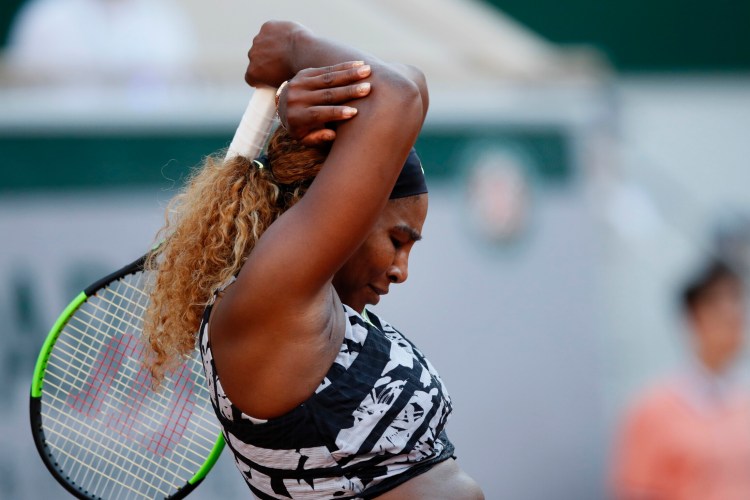 Serena Williams of the U.S. reacts after missing a shot and loosing her third round match of the French Open tennis tournament against Sofia Kenin of the U.S. in two sets, 2-6, 5-7, at the Roland Garros stadium in Paris, Saturday, June 1, 2019. 