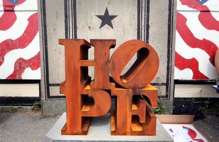 A steel version of Robert Indiana's HOPE sculpture is displayed outside his home on the first annual "International HOPE Day on his 86th birthday, Sept. 13, 2014, on Vinalhaven Island. 