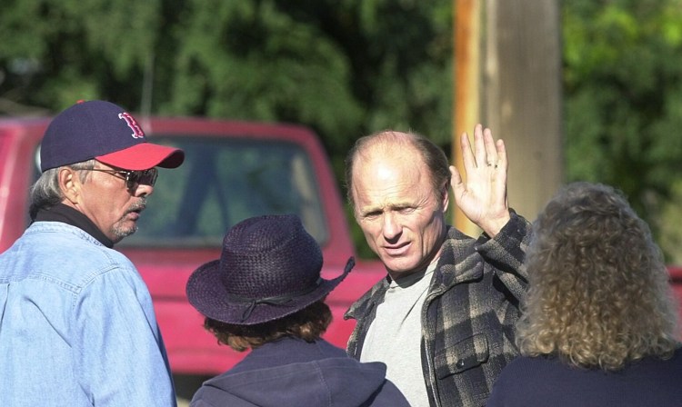 Ed Harris waves to a crowd of onlookers during a break from shooting on the set of "Empire Falls" at the Bob In in Waterville on Oct. 3, 2003. 