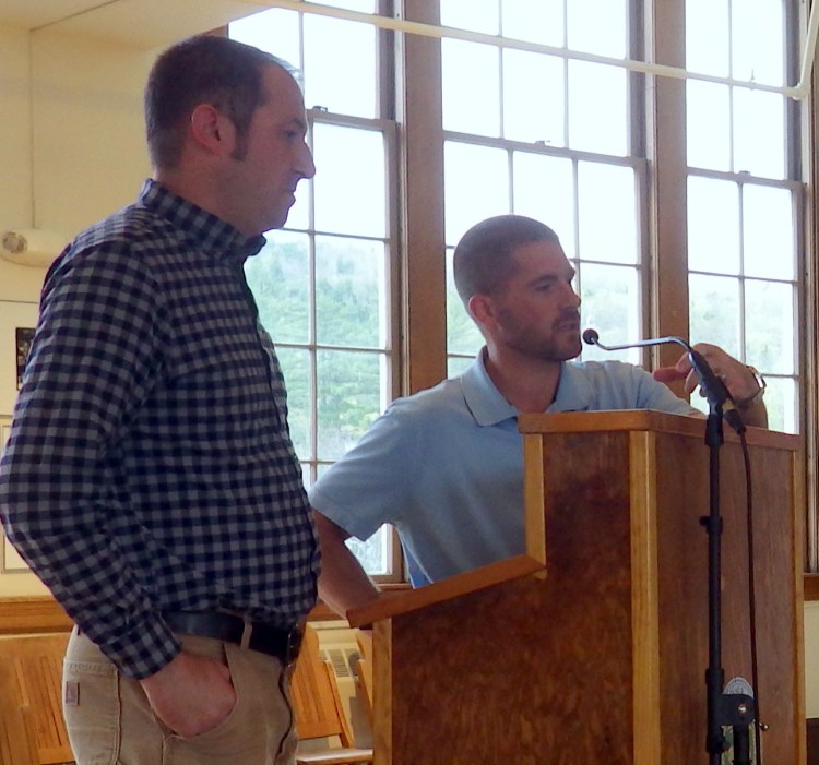 Engineers Nate Gustafson, left, and Travis Noyes of engineering firm CES Inc. of Brewer, discuss construction repairs at a meeting of the town's Board of Selectmen in October 2019. CES has acquired a small engineering firm in Massachusetts.