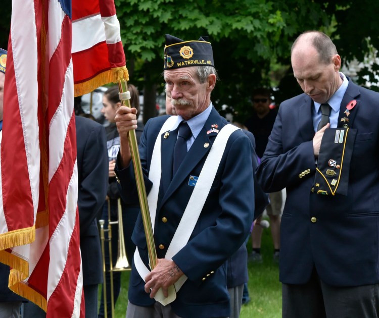 American Legion color guard members Frank McAdoo, left, and Craig Bailey take part in a Memorial Day ceremony on May 28, 2018, at Veterans Park in Waterville. 