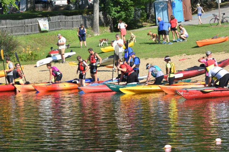 Kayakers on Messalonskee Lake in Oakland prepare for the first leg of the Paddle, Pedal and Pound Triathalon at last year’s Oakfest. The event includes a 2.5-mile kayak/canoe paddle, a 12-mile bike ride and a 3.1-mile run to the finish.