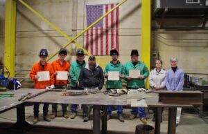 Successful welding program students (from left) Kurtis Polisky and Dustin Paine stand with Bancroft welding instructor Fred Locke, Bancroft project manager Kyle Lamb, fellow students Ryan Stuart and Christopher Willey, Patti Saarinen with the WMCA, and Oxford Hills/Nezinscot Adult Education director Tina Christophersen.