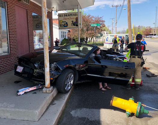 A 1989 mail truck collided with a 2013 Mustang convertible at the intersection of Getchell Street and College Avenue on Monday afternoon. Alexia Dumont, 18, of Albion, lost control of the car, which took out a fire hydrant and bumped up the concrete steps of R.E. Drapeau, a furniture and appliance store. No one was injured in the accident.