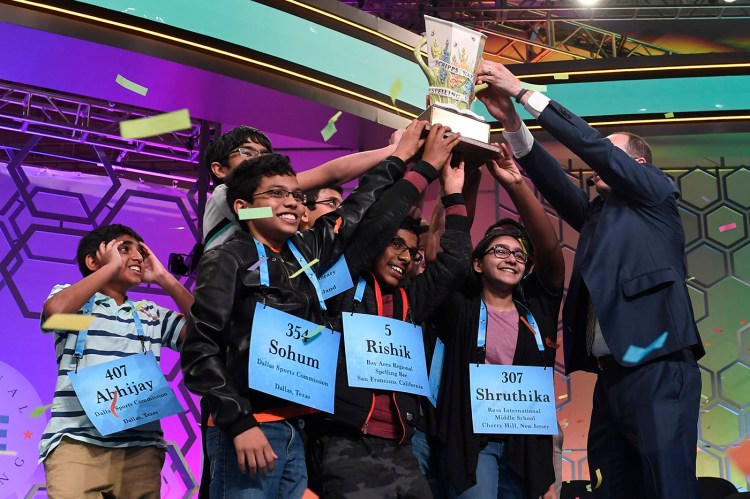 Winning spellers gather together at the end of the 2019 Scripps National Spelling Bee in Oxon Hill, Md.