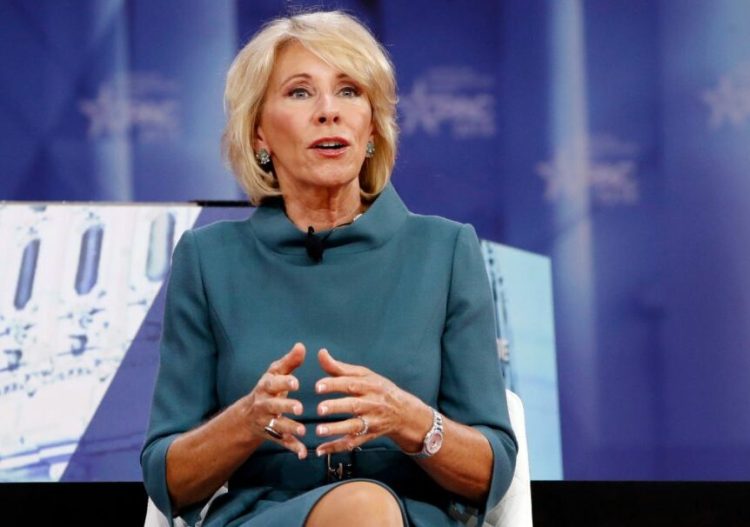 Education Secretary Betsy DeVos has hired several for-profit college insiders and frozen Obama-era rules.