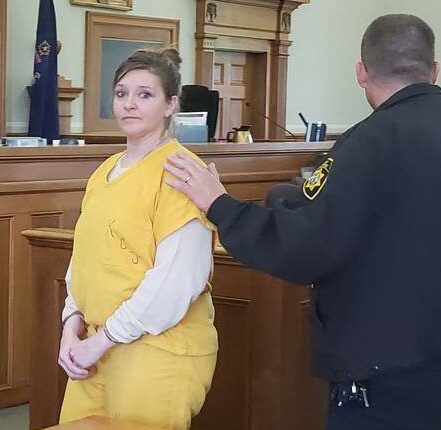 Sarah Richards is led out of the courtroom after pleading not guilty to murder in May. 