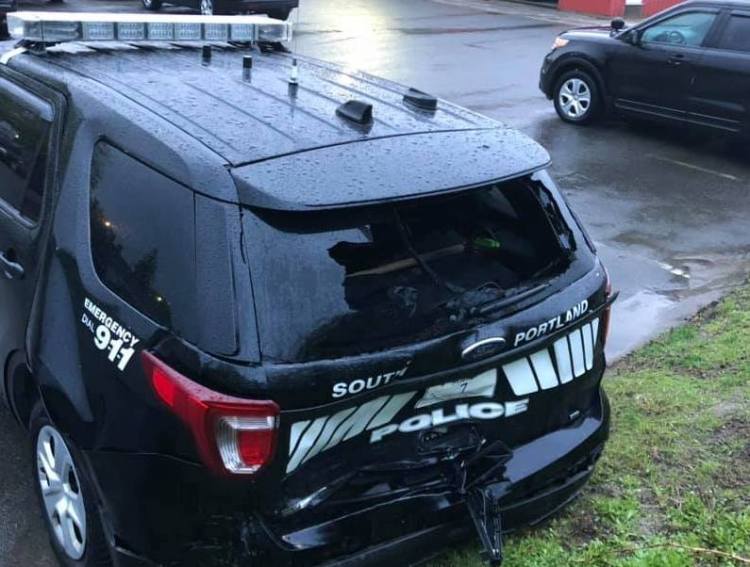 This South Portland police cruiser was struck while parked on 1-295 on Saturday night.