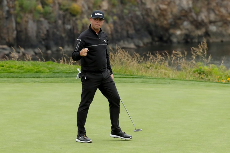 Gary Woodland reacts Friday after making a birdie on the fifth hole of the second round of the U.S. Open at Pebble Beach, Calif. Woodland will take a two-shot lead over Justin Rose into the third round.