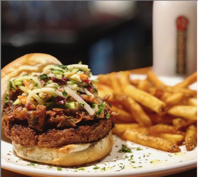 The Beyond Burger at Three Dollar Dewey's in Portland is served with jackfruit "pulled pork" and coleslaw or traditional toppings with vegan cheese. 