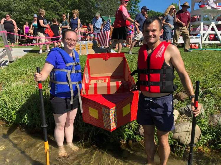 Jessica Butler, left, and her cousin Wes Danforth launch their canoe made out of cardboard and duct tape into Cochnewagon Lake during the 2018 Monmouth Beach Party in Monmouth. This year's event is scheduled for July 6, and the cardboard canoe race will launch at 4 p.m.