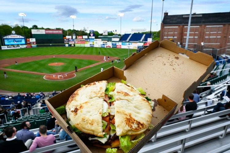 The new Fried Dough Burger at Hadlock Field: two frybreads, eight hamburger patties, bacon, cheese, lettuce and tomato. We hope you're hungry. 