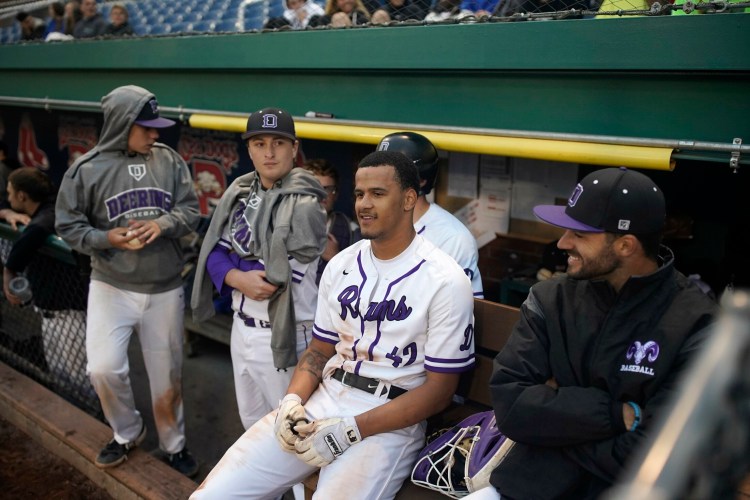 Deering High senior Trejyn Fletcher, center, is projected as a second- or third-round selection in Major League Baseball's amateur draft, which begins Monday.