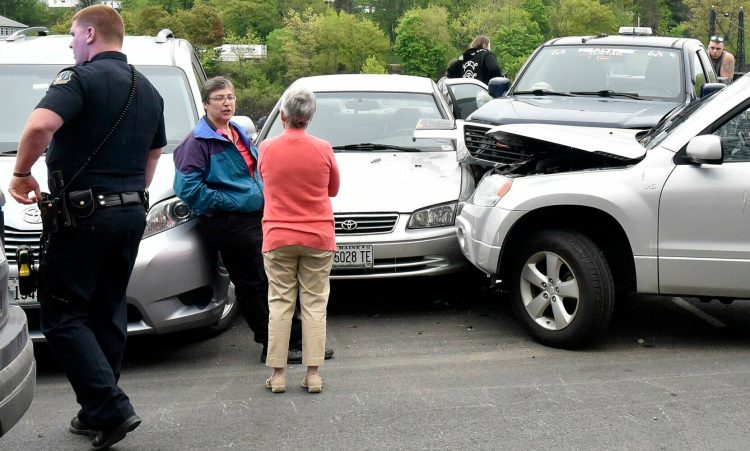 Waterville police, fire and ambulance personnel were sent to RiverWalk at Head of Falls in Waterville on Sunday after the driver of the vehicle at right plowed into four vehicles parked for a Central Maine Pride event.