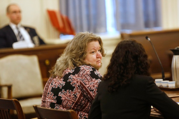 Kandee Weyland Collind looks toward her attorney, Molly Butler Bailey, during a court appearance in June 2019 to ask a judge to withdraw her guilty plea to the charge that she murdered her ex-husband. 