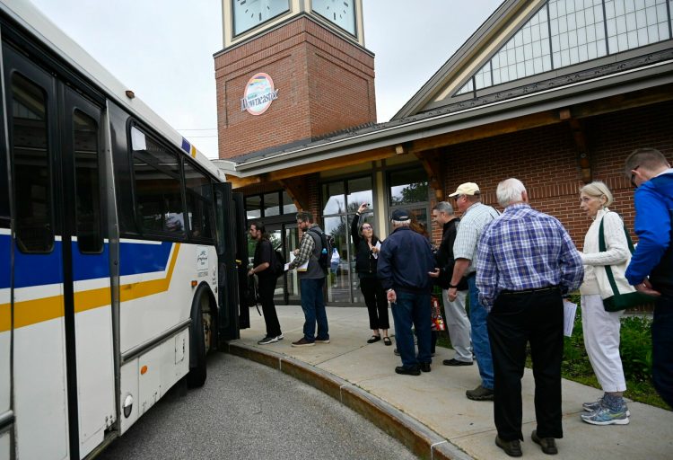 Regional transit leaders and elected officials board a bus to compete Friday in the Stupendous Tournament of Transit.