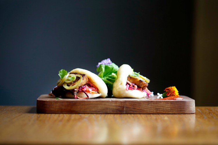 The wrapper is the weak link. Otherwise, the pork belly steamed buns at Odd Duck FSE make for "a lovely, fiery appetizer," according to our critic. 