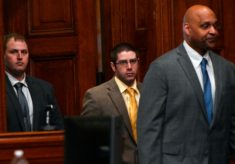 John D. Williams, center, is led into a Cumberland County courtroom for closing arguments in his murder trial Tuesday.
