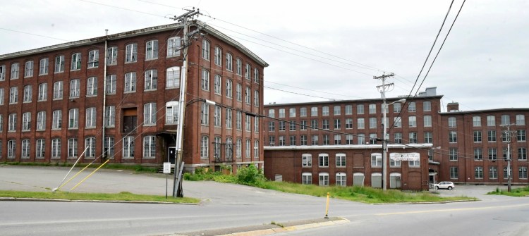 Developers plan to renovate the former Lockwood Mill buildings on Water Street in Waterville, near the Hathaway Creative Center, far right, for commercial and residential uses.