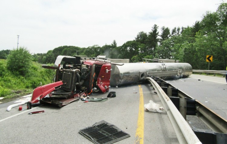 A tanker truck hauling milk overturned as it was exiting the Maine Turnpike in Falmouth on Thursday afternoon. The wreck blocked the southbound exit that leads to the Falmouth Spur at mile 52. 