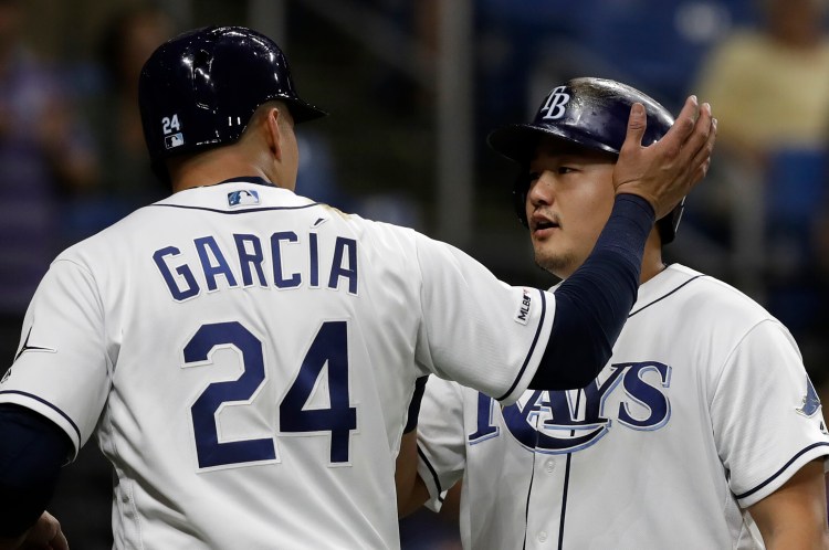 Tampa Bay's Ji-Man Choi, right, celebrates with Avisail Garcia after hitting a two-run home run off Oakland Athletics relief pitcher Joakim Soria in the eighth inning of the Rays' 6-2 win Monday in St. Petersburg, Florida. 
