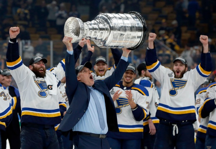 St. Louis Blues Coach Craig Berube carries the Stanley Cup after the Blues defeated the Boston Bruins in Game 7.