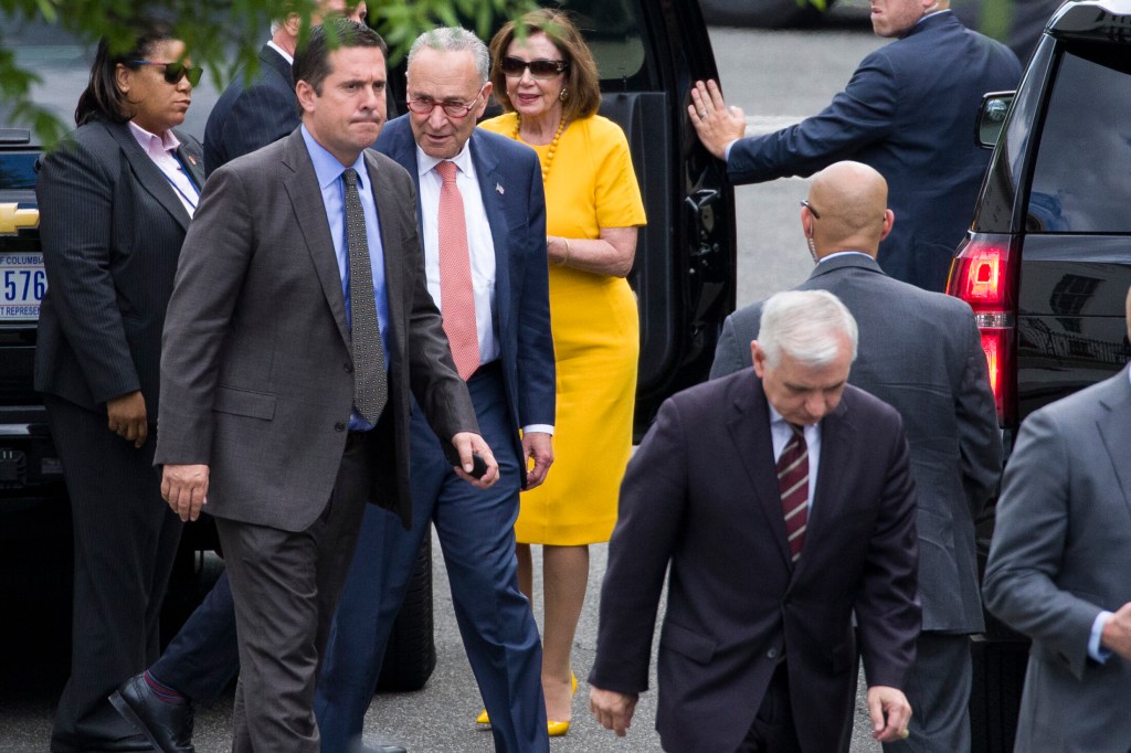 Rep. Devin Nunes, R-Calif., ranking member of the House Intelligence Committee, second from left; Senate Minority Leader Chuck Schumer, D-N.Y.; House Speaker Nancy Pelosi, D-Calif., Sen. Jack Reed, D-R.I., foreground, and others depart the White House after a meeting Thursday with President Trump about escalating tensions with Iran.