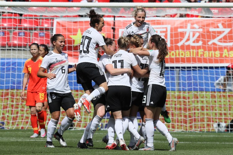 Germany's Giulia Gwinn celebrates with teammates after scoring the only goal of the game in a 1-0 win over China on Saturday in the Women's World Cup in Rennes, France.