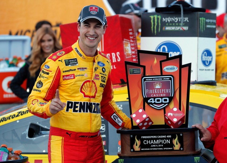 Joey Logano celebrates after winning the NASCAR Cup Series race at Michigan International Speedway on Monday in Brooklyn, Michigan.