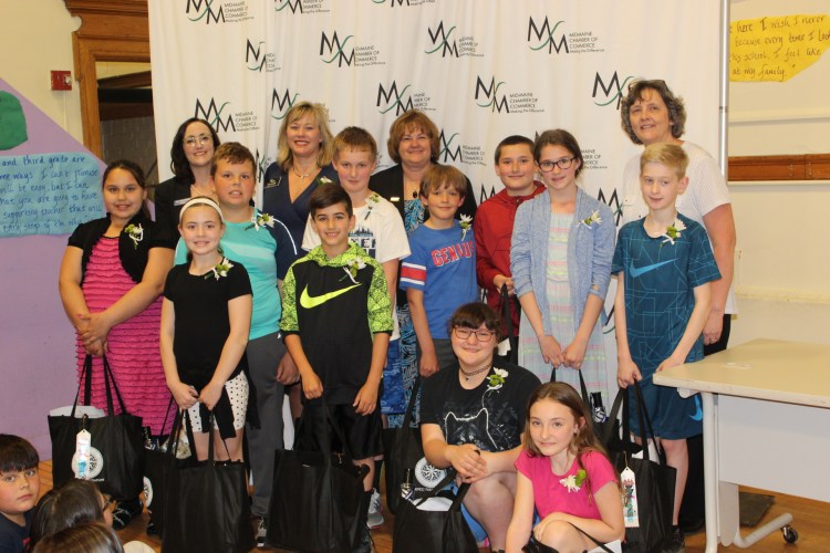 Albert S. Hall School perfect attendance students were honored June 14 at the Watervilel school. Kneeling from left are Jayda Dunn and Theresa Bickford. Second row from left are Kierstyn Glidden, Ava Fortuna, Forrest Poulin, Hunter Willett, Derek Couture, Ilya Ansdell, Daniel Joler, Kyleigh Parker and Trevor Tardif. Back from left are Kristine Black, of Bangor Savings Bank; Michele Prince, of Waterville Rotary Club; Kimberly Lindlof, of Mid-Maine Chamber of Commerce; and Principal Barbara Jordan.