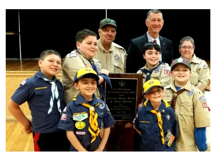 Pine Tree Council Scouts of America presented its 2019 Distinguished Citizen Award to Central Maine Power Co. In front from left, are Jaxon Boyd, Tristan Morton, Cooper Selwood and Jeffrey Mason. In back, from left, are Isaac Boyd, Douglas Mason, CMP CEO Doug Herling, Anthony Fortin and Michelle Selwood. The Scouts represent Scout Troop 603 and Cub Pack 603.